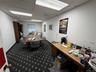 Office featuring a drop ceiling