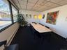 Dining room featuring a baseboard heating unit and a drop ceiling