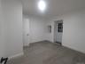 Empty room with baseboards and wood finished floors