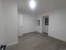Empty room with baseboards and wood finished floors