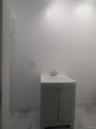 Bathroom with light marble finish flooring and vanity