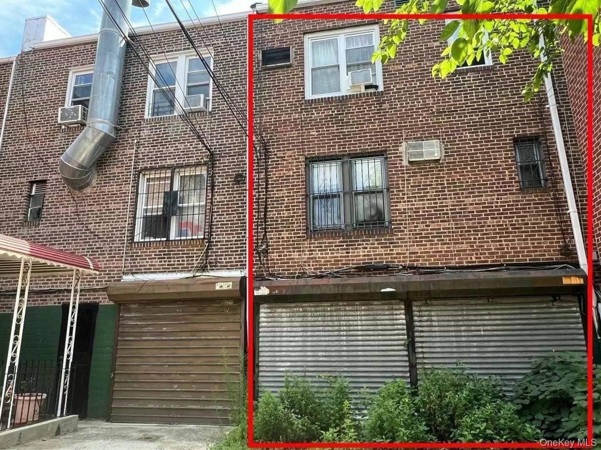 View of side of property featuring brick siding