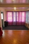 Unfurnished room with healthy amount of natural light and wood finished floors