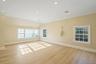 Empty room with light wood finished floors, ornamental molding, and recessed lighting