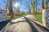 View of asphalt driveway with curbs