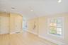 Unfurnished room featuring recessed lighting, light wood-style flooring, and vaulted ceiling