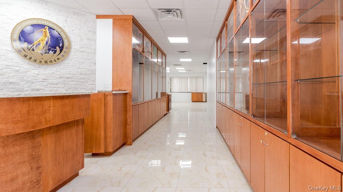Corridor featuring a paneled ceiling