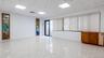 Spare room with a paneled ceiling and light marble finish flooring