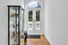Foyer with hardwood / wood-style floors and french doors