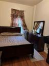 Bedroom with wood finished floors