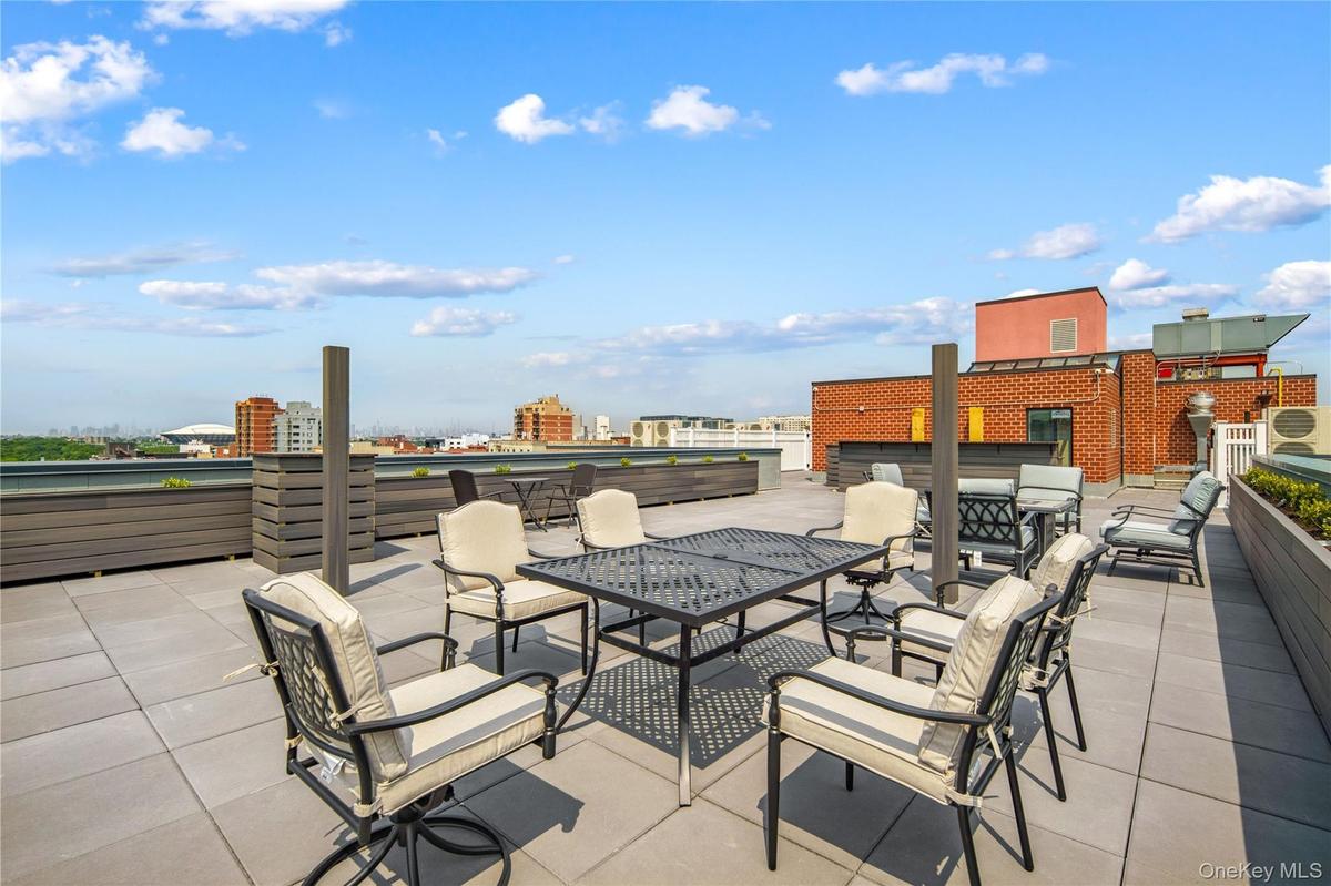 View of patio / terrace featuring outdoor dining space and a view of city