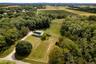 Aerial view of property's location with rows of crops and rural landscape