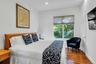 Bedroom with dark wood-type flooring and recessed lighting