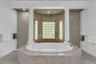 Full bath with a bath, tile patterned floors, and recessed lighting
