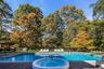 View of pool featuring a patio and an in-ground hot tub