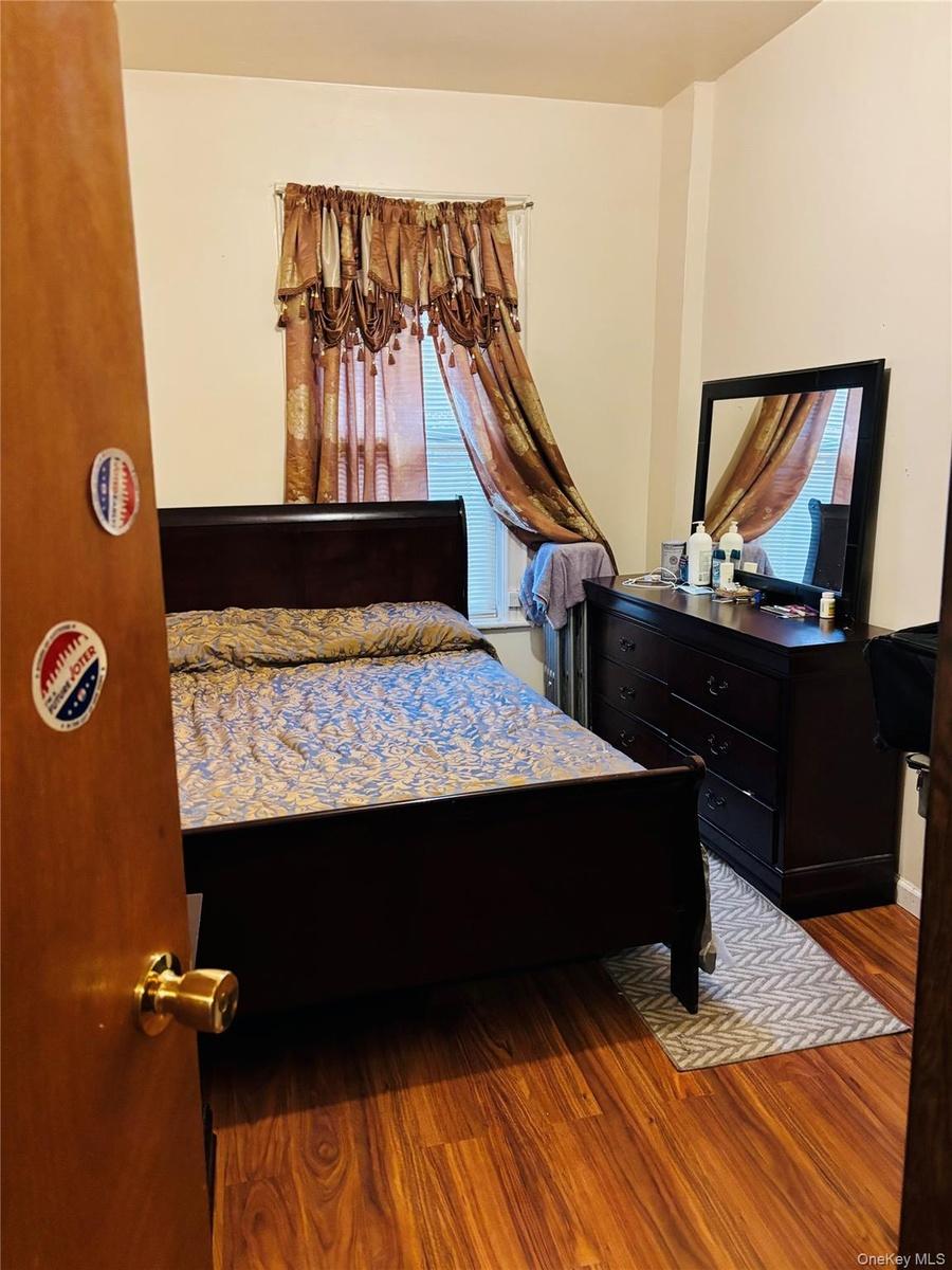 Bedroom with wood finished floors