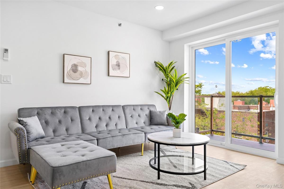 Living room with recessed lighting and light wood-style floors