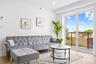 Living room with recessed lighting and light wood-style floors