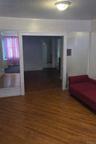 Corridor featuring dark wood-style flooring