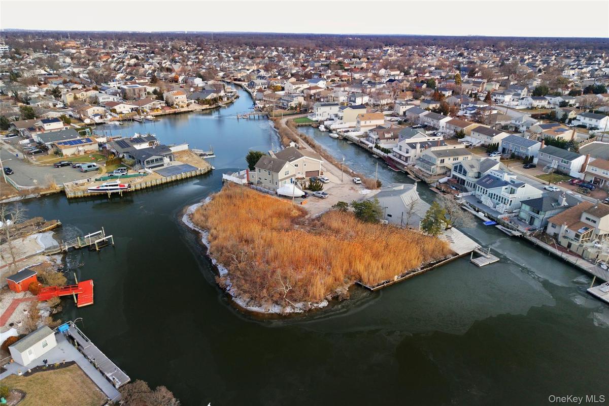 Aerial view of residential area with a large body of water