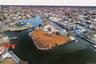 Aerial view of residential area with a large body of water
