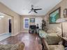 Living room featuring hardwood / wood-style floors and ceiling fan