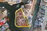 Aerial view of property and surrounding area featuring property parcel outlined