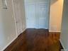 Corridor with dark wood finished floors