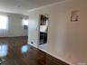 Dining room and living room featuring dark style wood flooring