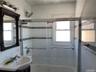 Full bath with bath / shower combo with glass door and vanity