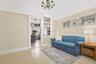 Living area featuring a chandelier and hardwood / wood-style floors