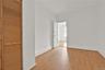 Unfurnished bedroom with a closet and wood finished floors