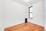 Empty room with radiator and wood finished floors