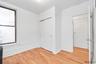 Unfurnished bedroom with a closet and light wood-style floors