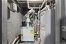 Utility room featuring water heater