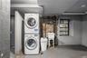 Laundry room featuring estacked washer and dryer