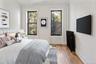Bedroom featuring hardwood / wood-style floors and baseboards