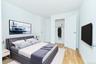 Bedroom with a closet and light wood-type flooring