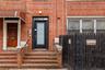 Entrance to property featuring brick siding