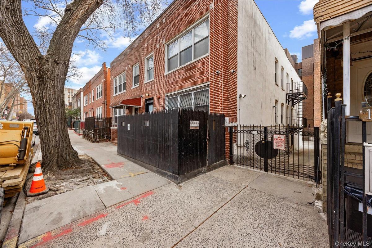 View of property featuring a fenced front yard