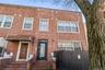 Traditional-style home featuring brick siding