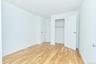 Unfurnished bedroom with light wood-type flooring and a closet