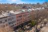 Bird's eye view of apartment complex and skyline