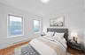 Bedroom with a baseboard heating unit and baseboards