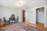 Office with light wood-style floors and baseboards