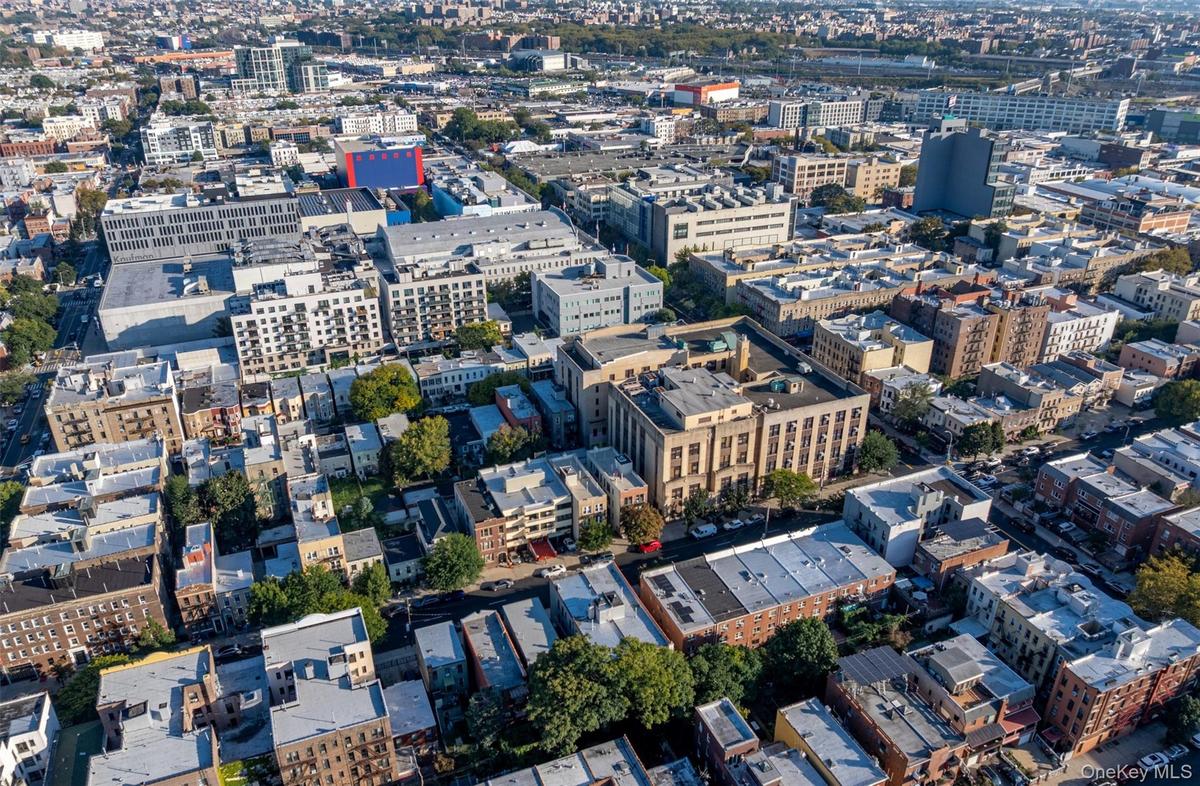 View of property location with nearby urban area