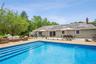 Outdoor pool featuring a patio area, an outdoor living space, outdoor dining space, and grilling area