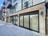 Doorway to property featuring brick siding