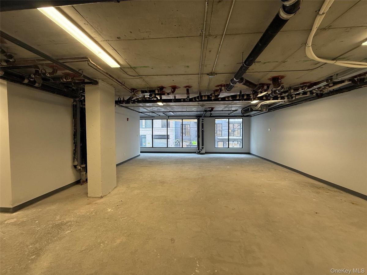 Below grade area featuring baseboards