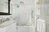 Full bath with vanity and tiled shower / bath combo